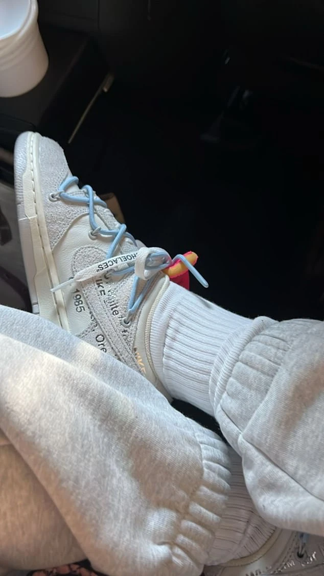 Pristine: The final photo centered on her white Nike sneakers and matching white socks
