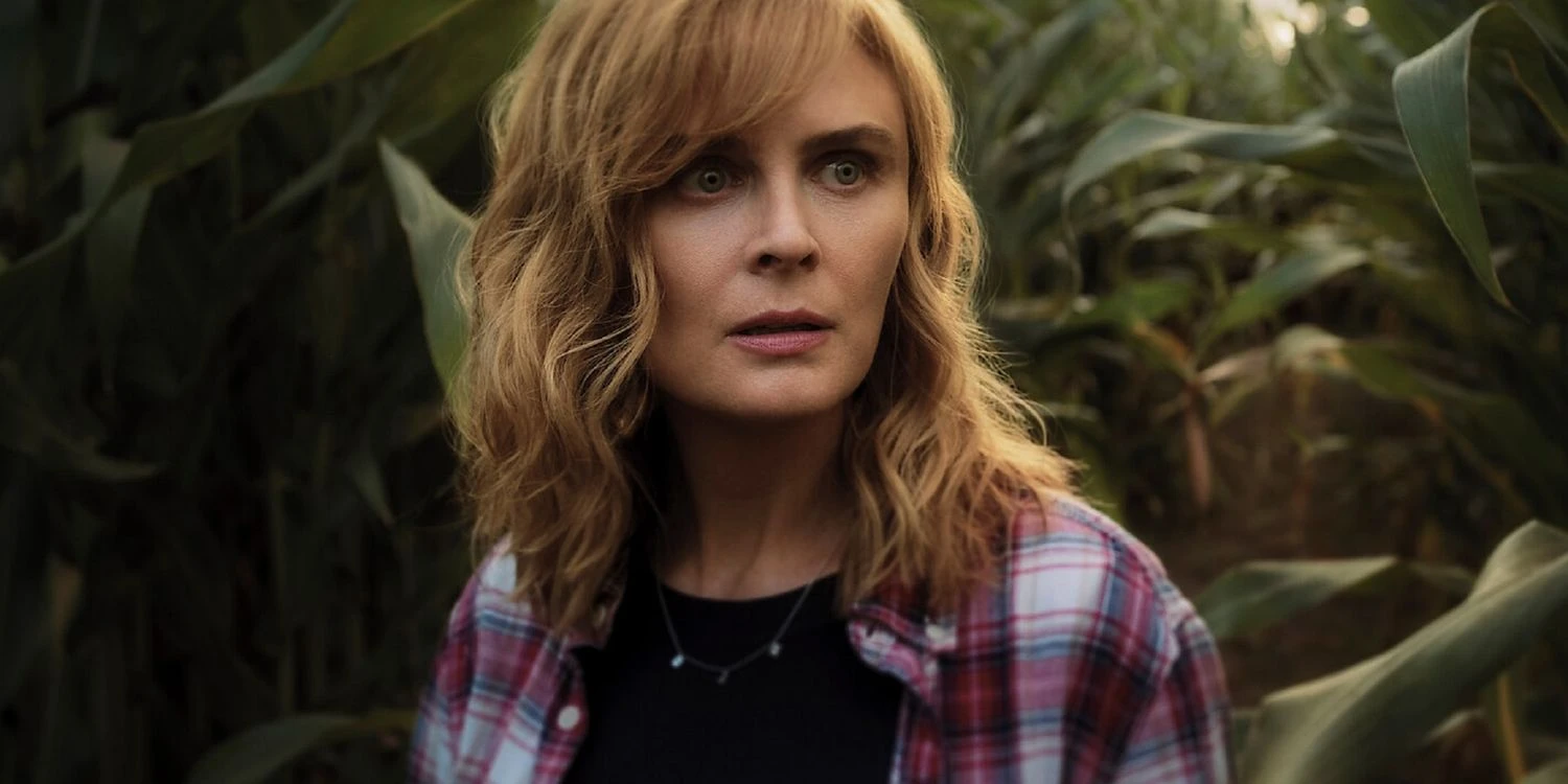 Emily Deschanel's character standing in a cornfield looking scared in 