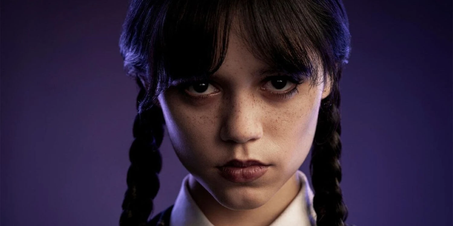Jenny Ortega stares at the camera as Wednesday Addams in 