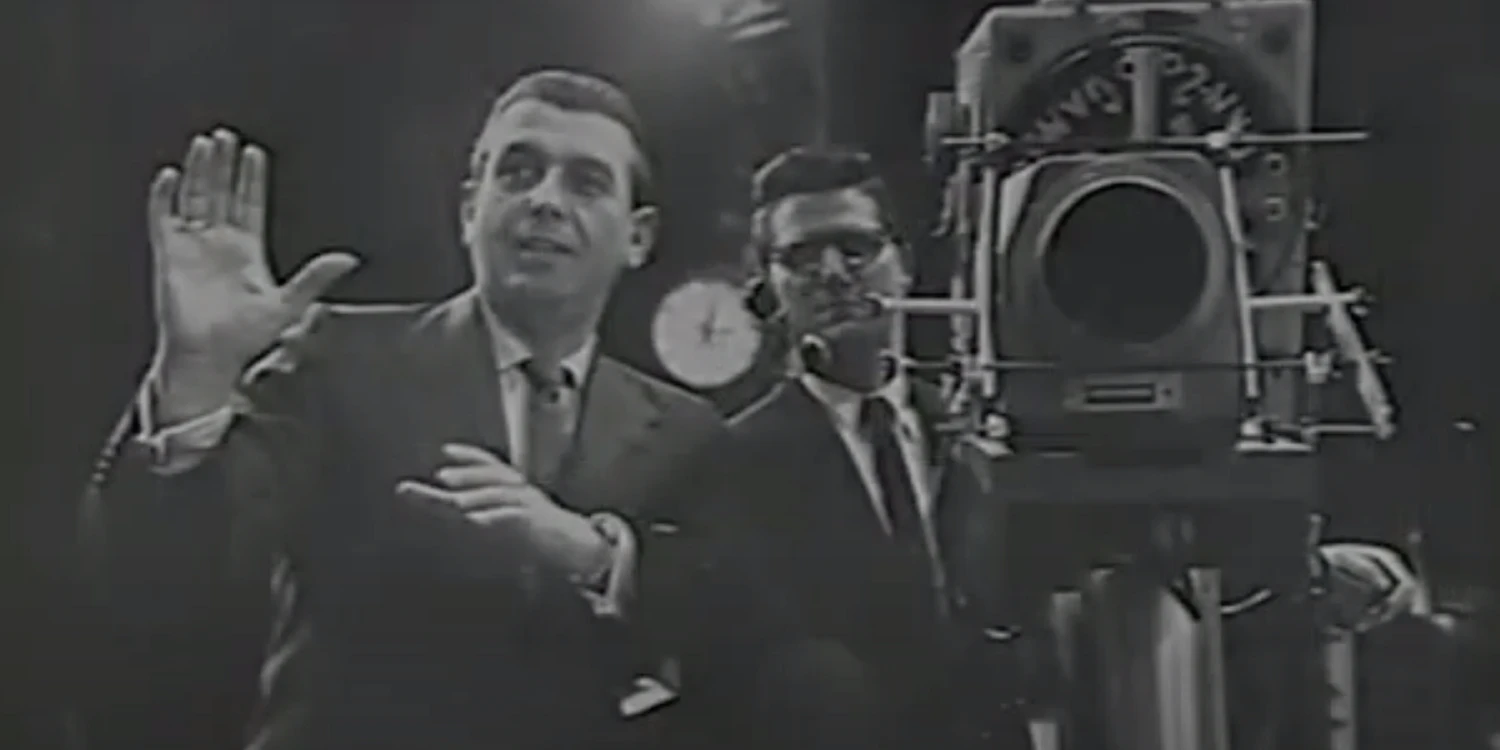 Dennis James directing a camera